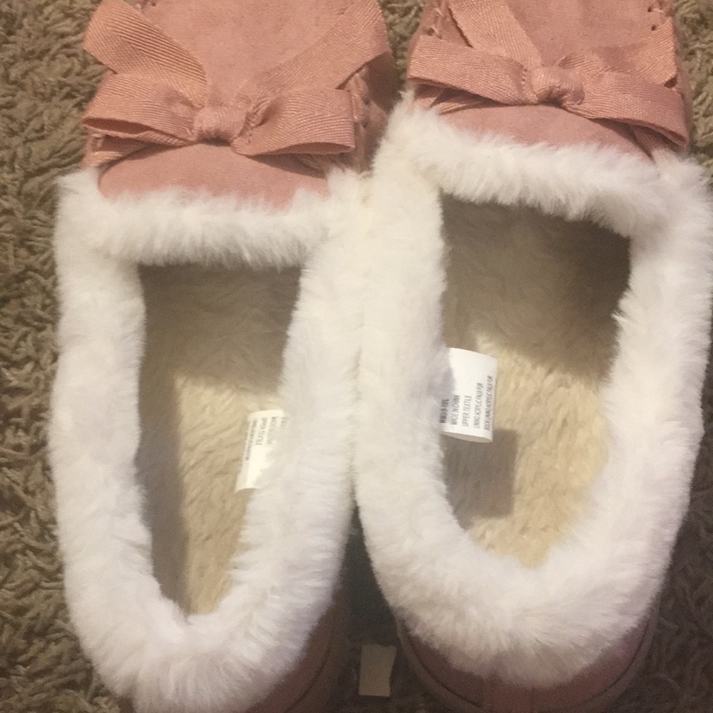 Pink fuzzy slippers.
